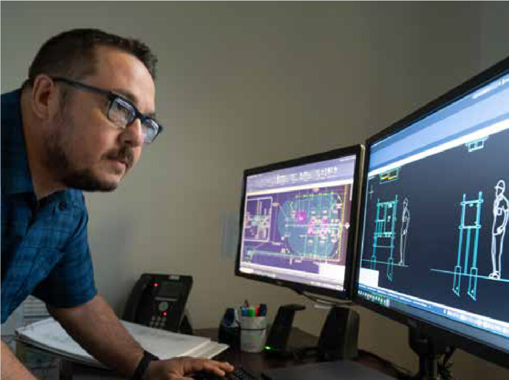 Man at computer screens